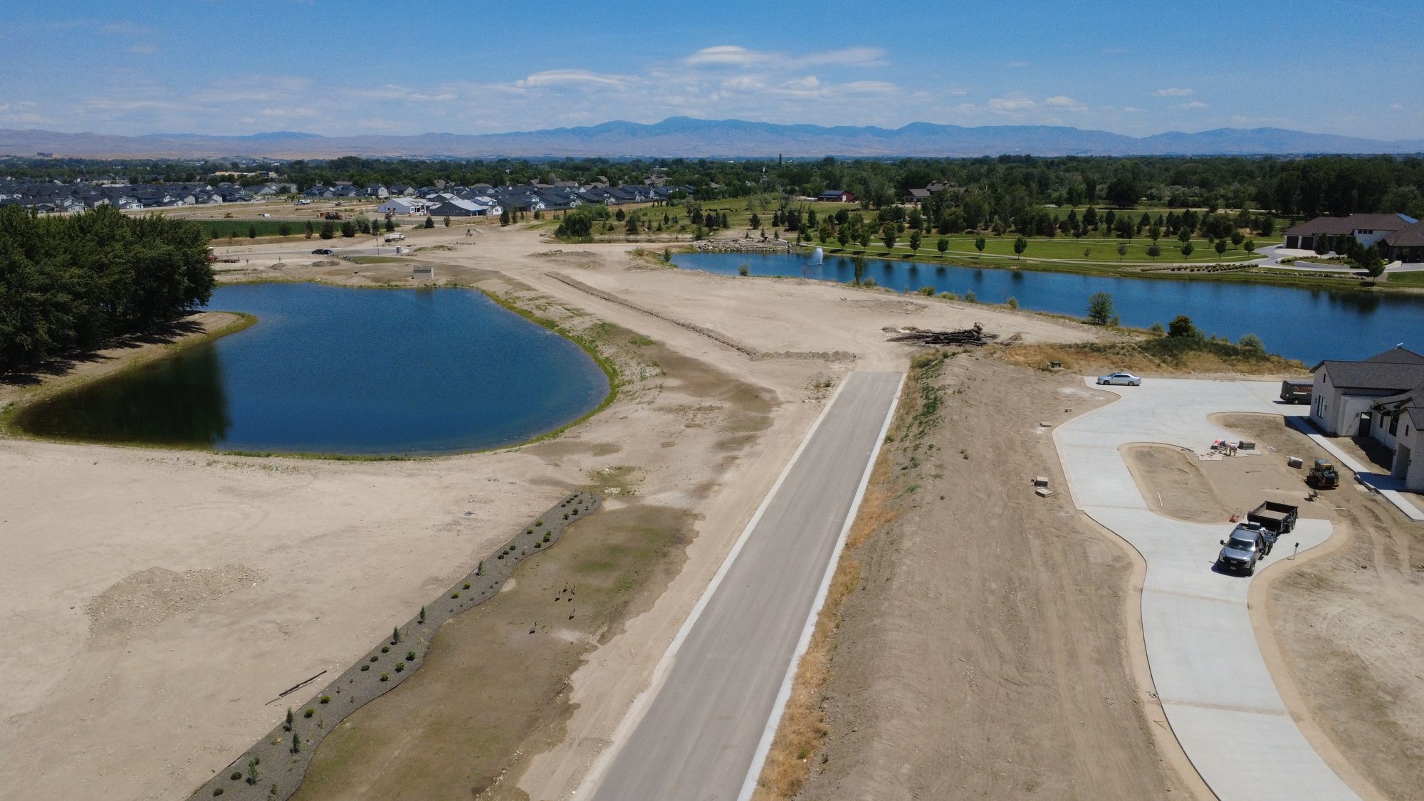 Chateau Place at Lakehaven Estates with both lakes and the mountains beyond